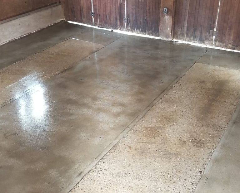 Rich custom-colored painted concrete floor by Alliance Epoxy Flooring
